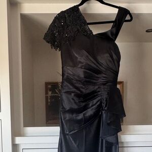 Women’s black full length dress gown.